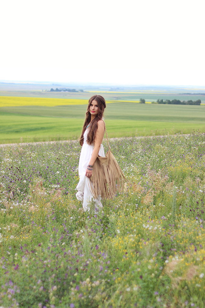 What to Wear to | The Calgary Stampede | Bohemian White Maxi Dress in a Field of Wildflowers // JustineCelina.com