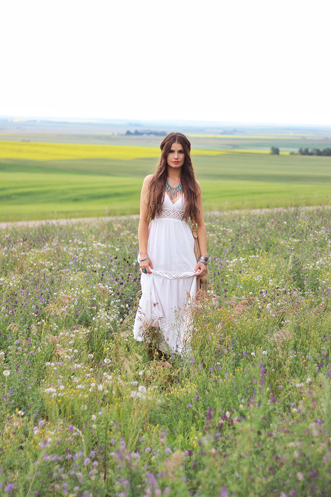What to Wear to | The Calgary Stampede | Bohemian White Maxi Dress in a Field of Wildflowers // JustineCelina.com