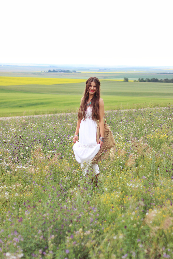 What to Wear to | The Calgary Stampede | Bohemian White Maxi Dress in a Field of Wildflowers // JustineCelina.com