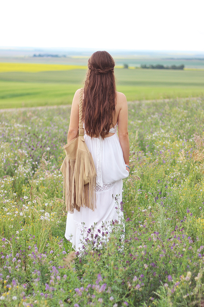  What to Wear to | The Calgary Stampede | Bohemian White Maxi Dress in a Field of Wildflowers // JustineCelina.com