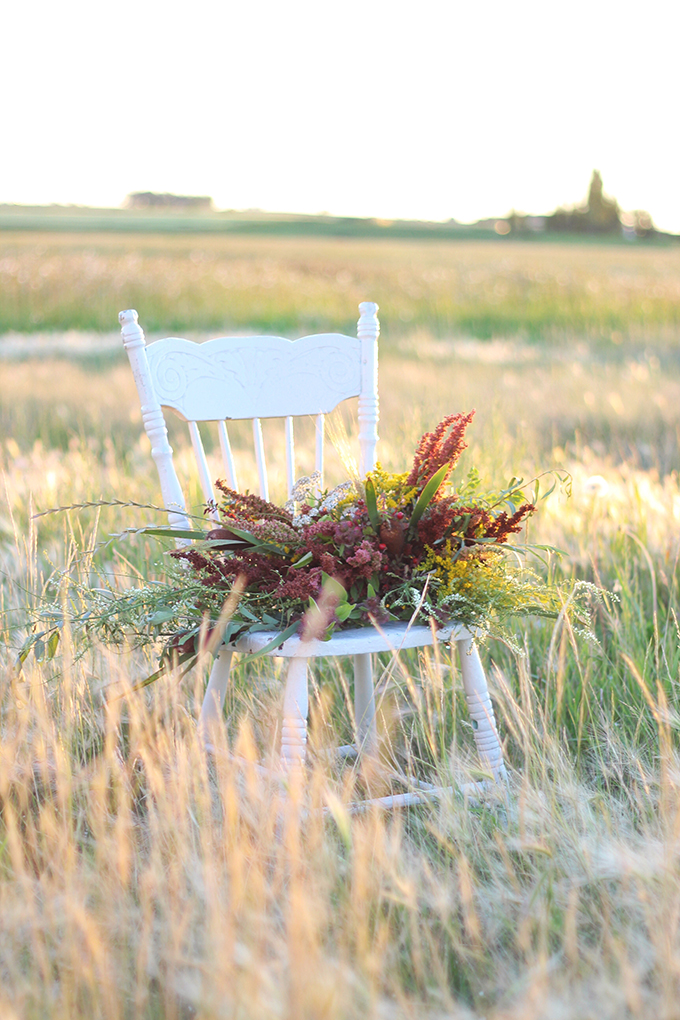 Foraged Prairie Wildflower Bouquet on a White Antique Chair in a Field | Calgary, Alberta, Canada // JustineCelina.com