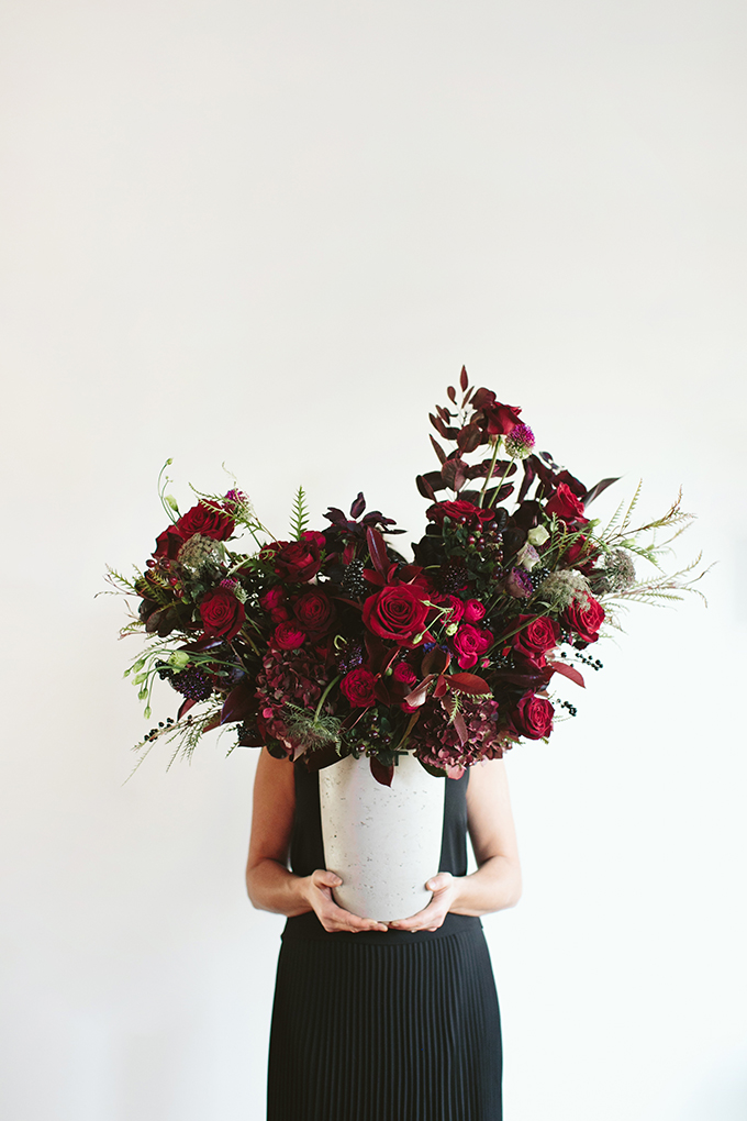 Luxe Holiday Floral Inspiration | Moody Winter Flower Arrangement with Black Magic Roses, Black Baccara Roses Gem and Lace Spray Garden Roses, Liqustrom, Hypericum, Allium, Lisianthus, Scabiosa, Chocolate Lace, Cotinus, Photina and Grevillea by Rebecca Dawn Design // JustineCelina.com