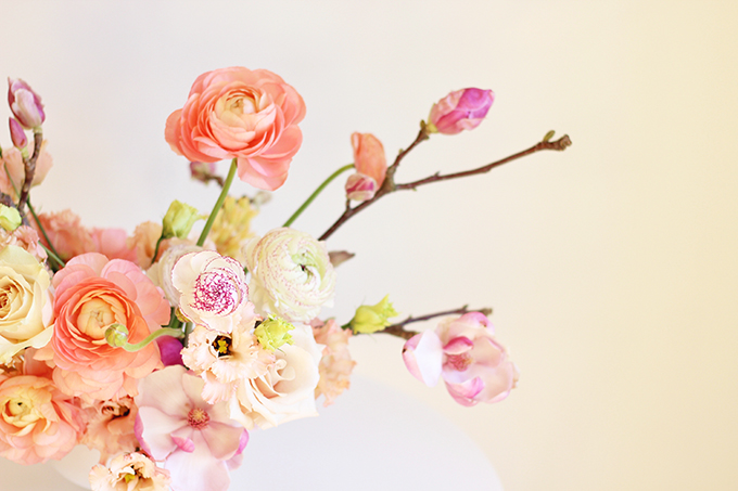 A Blushing Spring Arrangement with Coral Japanese Ranunculus, Lisianthus, Hyancith, Magnolia and Quicksand Roses | Spring Wedding Flower Ideas | Pantone Colour Trends Spring 2017 // JustineCelina.com