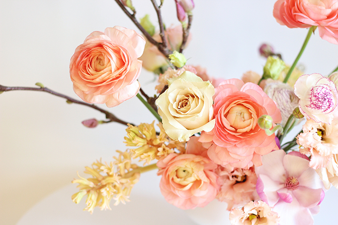 A Blushing Spring Arrangement with Coral Japanese Ranunculus, Lisianthus, Hyancith, Magnolia and Quicksand Roses | Spring Wedding Flower Ideas | Pantone Colour Trends Spring 2017 // JustineCelina.com