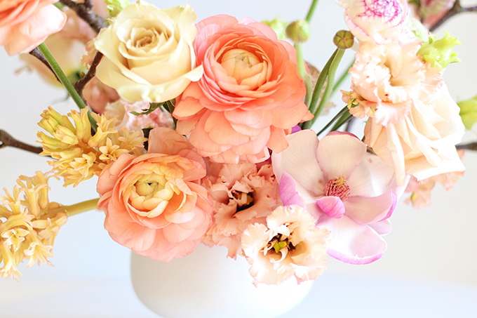 A Blushing Spring Arrangement with Coral Japanese Ranunculus, Lisianthus, Hyancith, Magnolia and Quicksand Roses | Spring Wedding Flower Ideas | Pantone Colour Trends Spring 2017 // JustineCelina.com