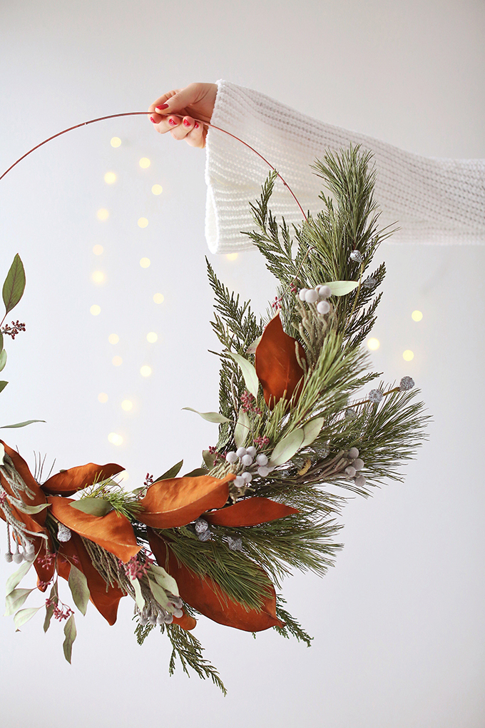 DIY | Asymmetrical Holiday Wreath | How to Make an Asymmetrical Holiday Wreaths for Christmas with Pine, Cedar, Brunia, Eucalyptus pods, Red Ironbark Eucalyptus and Magnolia | Christmas Wreath DIY | Modern Christmas Wreath DIY // JustineCelina.com