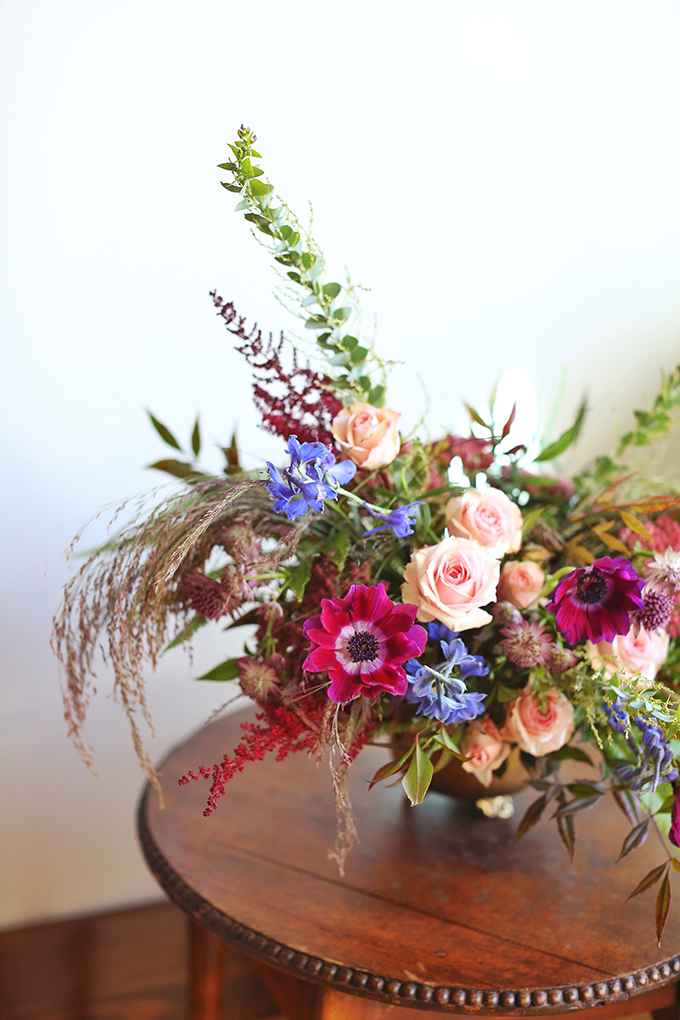 A PANTONE 2018 Ultra Violet Inspired Arrangement with Anemones, Spray Roses, Bella Donna, Dephinium, Astrantia, Astilbe, Sedum, Ruby Silk Grass, Nandina, Umbrella Fern and Knife blade Acacia // JustineCelina.com x Rebecca Dawn Design