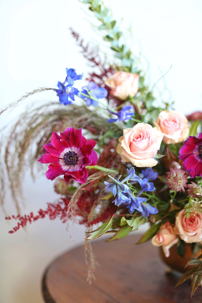 A PANTONE 2018 Ultra Violet Inspired Arrangement with Anemones, Spray Roses, Bella Donna, Dephinium, Astrantia, Astilbe, Sedum, Ruby Silk Grass, Nandina, Umbrella Fern and Knife blade Acacia // JustineCelina.com x Rebecca Dawn Design