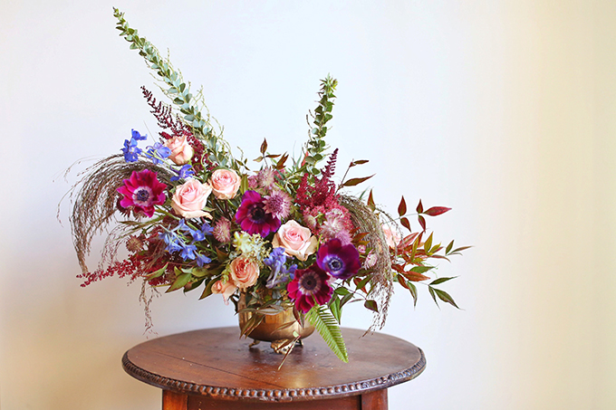 A PANTONE 2018 Ultra Violet Inspired Arrangement with Anemones, Spray Roses, Bella Donna, Dephinium, Astrantia, Astilbe, Sedum, Ruby Silk Grass, Nandina, Umbrella Fern and Knife blade Acacia // JustineCelina.com x Rebecca Dawn Design