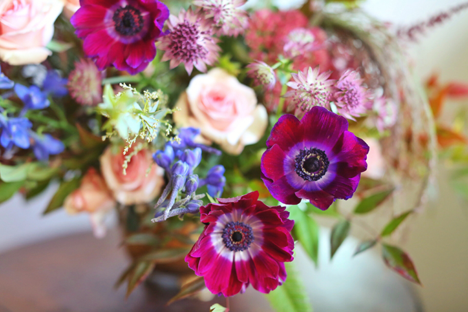 A PANTONE 2018 Ultra Violet Inspired Arrangement with Anemones, Spray Roses, Bella Donna, Dephinium, Astrantia, Astilbe, Sedum, Ruby Silk Grass, Nandina, Umbrella Fern and Knife blade Acacia // JustineCelina.com x Rebecca Dawn Design