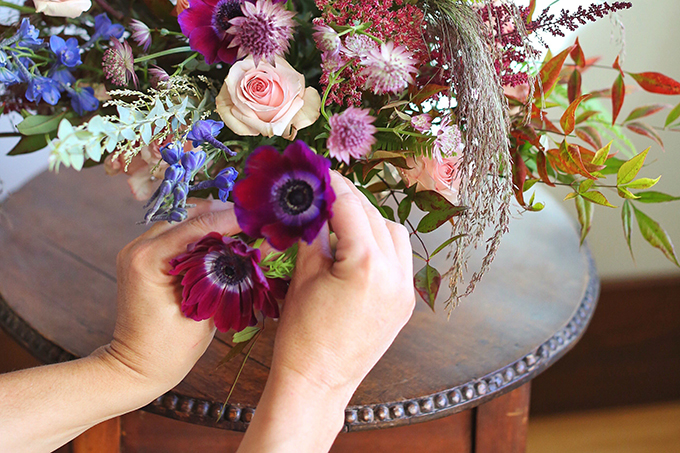 A PANTONE 2018 Ultra Violet Inspired Arrangement with Anemones, Spray Roses, Bella Donna, Dephinium, Astrantia, Astilbe, Sedum, Ruby Silk Grass, Nandina, Umbrella Fern and Knife blade Acacia | Step by Step Flower Arranging Guide // JustineCelina.com x Rebecca Dawn Design