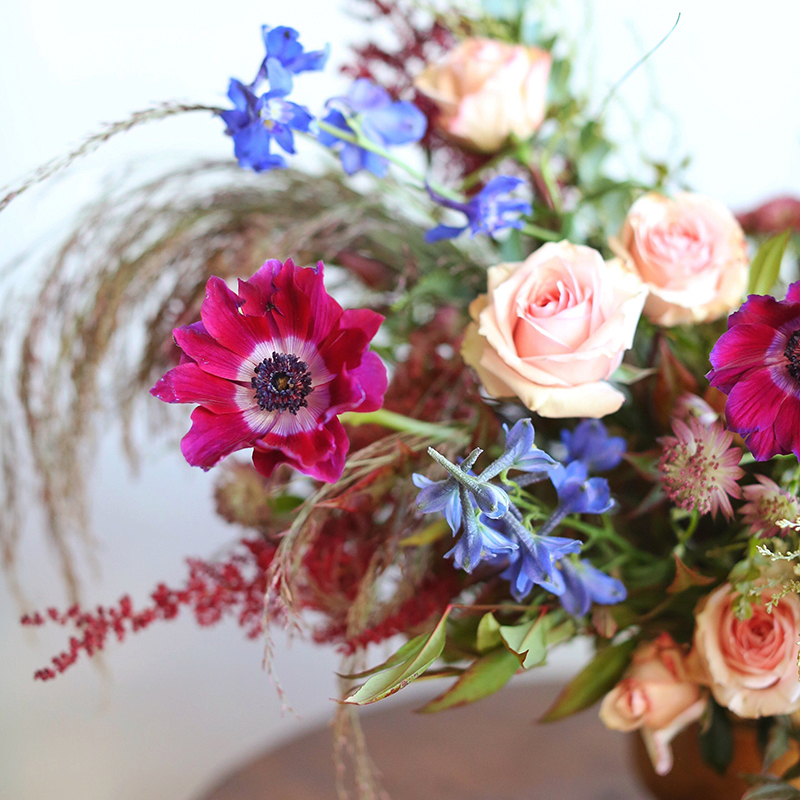 A PANTONE 2018 Ultra Violet Inspired Arrangement with Anemones, Spray Roses, Bella Donna, Dephinium, Astrantia, Astilbe, Sedum, Ruby Silk Grass, Nandina, Umbrella Fern and Knife blade Acacia // JustineCelina.com x Rebecca Dawn Design