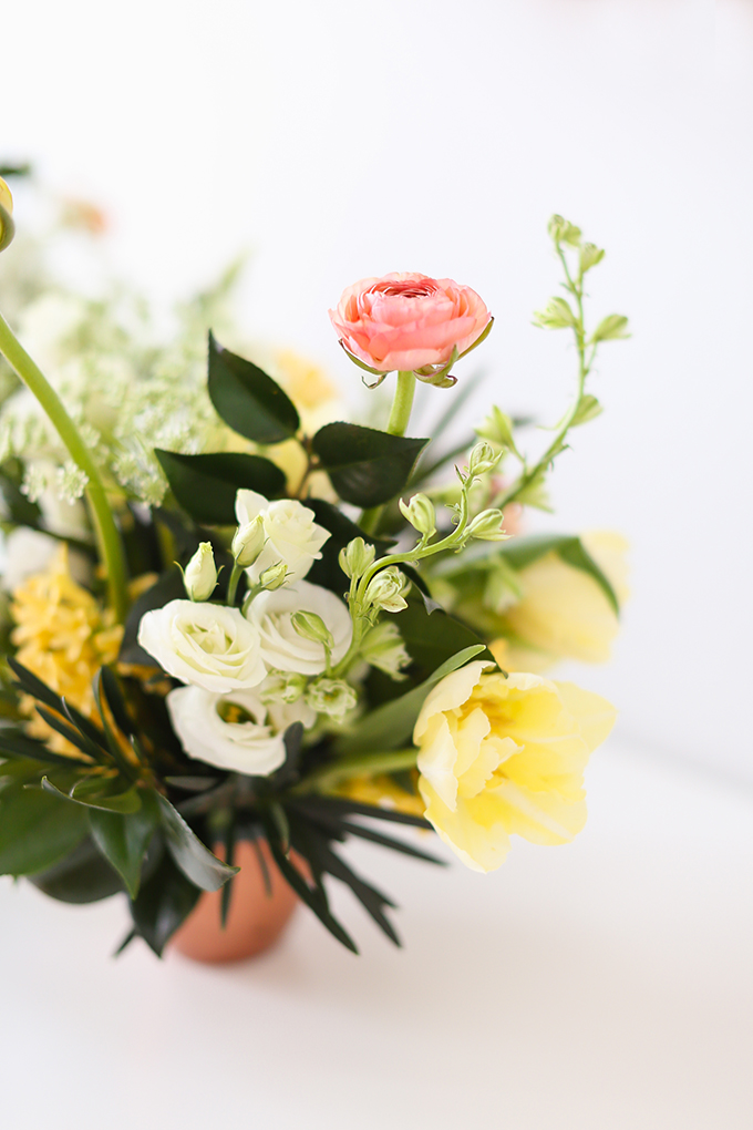 How to Unite a Space With Flowers | A Cheerful Spring Arrangement featuring Hyacinths, Double tulips, Ranunculus, Larkspur, Queen Anne’s Lace, Quicksand roses, Lisianthus, Camellia, Willow Eucalyptus and Podocarpus created by Rebecca Dawn Design // JustineCelina.com