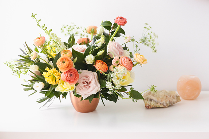 How to Unite a Space With Flowers | A Cheerful Spring Arrangement featuring Hyacinths, Double tulips, Ranunculus, Larkspur, Queen Anne’s Lace, Quicksand roses, Lisianthus, Camellia, Willow Eucalyptus and Podocarpus created by Rebecca Dawn Design // JustineCelina.com