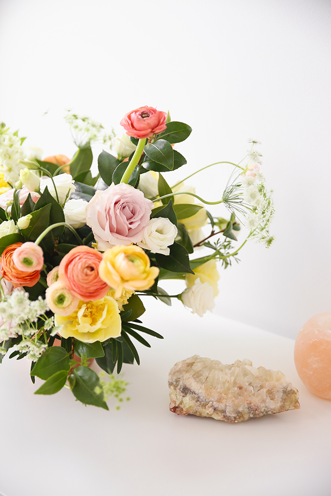 How to Unite a Space With Flowers | A Cheerful Spring Arrangement featuring Hyacinths, Double tulips, Ranunculus, Larkspur, Queen Anne’s Lace, Quicksand roses, Lisianthus, Camellia, Willow Eucalyptus and Podocarpus created by Rebecca Dawn Design // JustineCelina.com