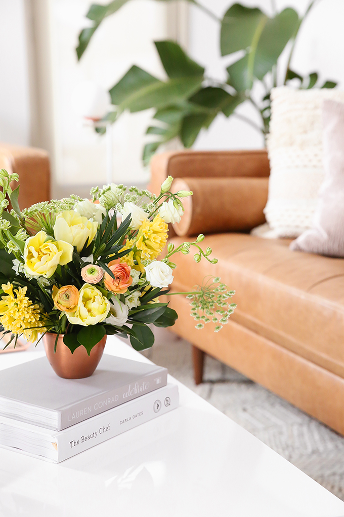 How to Unite a Space With Flowers | A Cheerful Spring Arrangement featuring Hyacinths, Double tulips, Ranunculus, Larkspur, Queen Anne’s Lace, Quicksand roses, Lisianthus, Camellia, Willow Eucalyptus and Podocarpus created by Rebecca Dawn Design // JustineCelina.com