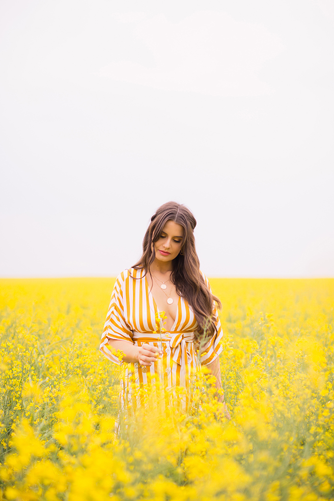 Pattern Play | Stripes | How to Style Stripes for Summer 2018 | The Best Striped Dresses 2018 | Mustard Striped Button Down Dress | Woman in a field of Canola | Calgary Fashion Blogger | Canadian Fashion Blogger // JustineCelina.com