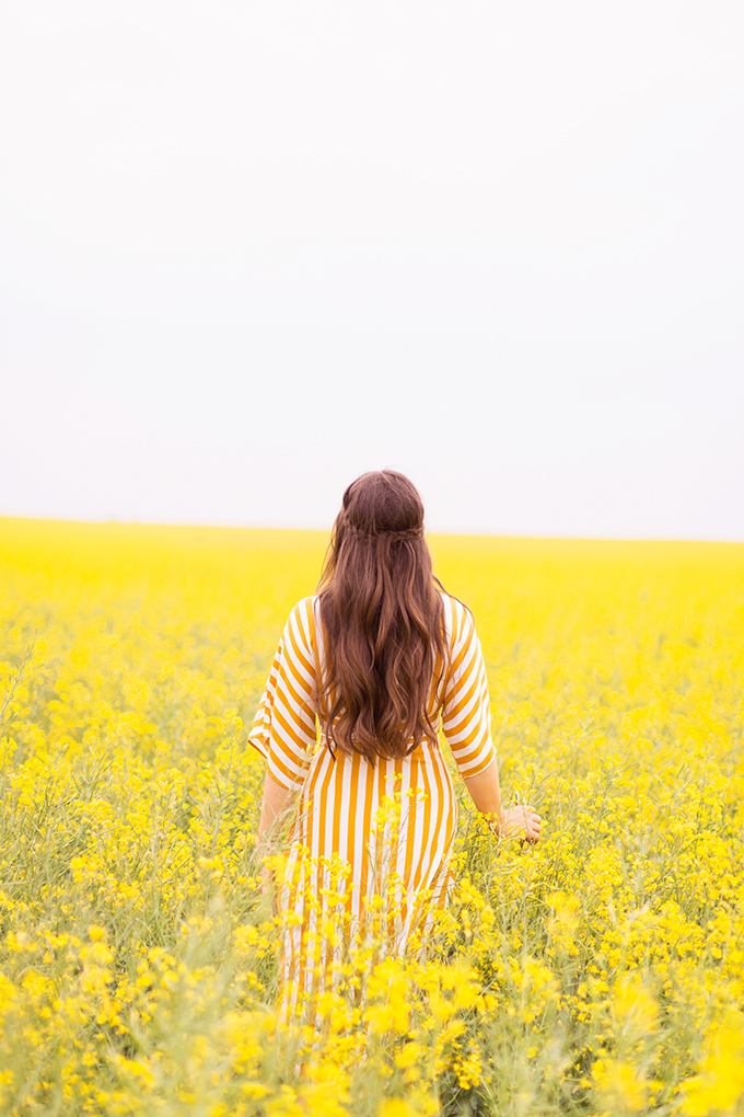 Pattern Play | Stripes | How to Style Stripes for Summer 2018 | The Best Striped Dresses 2018 | Mustard Striped Button Down Dress | Woman in a field of Canola | Calgary Fashion Blogger | Canadian Fashion Blogger // JustineCelina.com