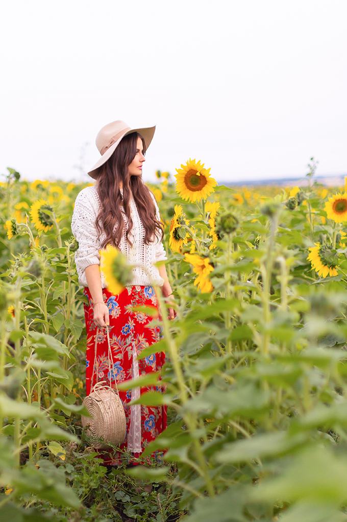 Autumn 2018 Lookbook | How to Style Maxi Dresses for Autumn | Girl wearing a maxi dress and hat in a sunflower field at the Bowden Sunmaze at Sunset, Alberta, Canada | Calgary Lifestyle Blogger | Autumn 2018 Trends | JustineCelina.com