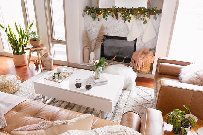 Apartment Friendly Modern Holiday Decor | Simple Holiday Arrangement on a Coffee Table with Greenery and Cotton Stems and 2 glasses of red wine | Bohemian, Mid Century Modern Holiday Decor | Bohemian Holiday Home Tour 2018 | Canadian Tire CANVAS Ornaments // JustineCelina.com 