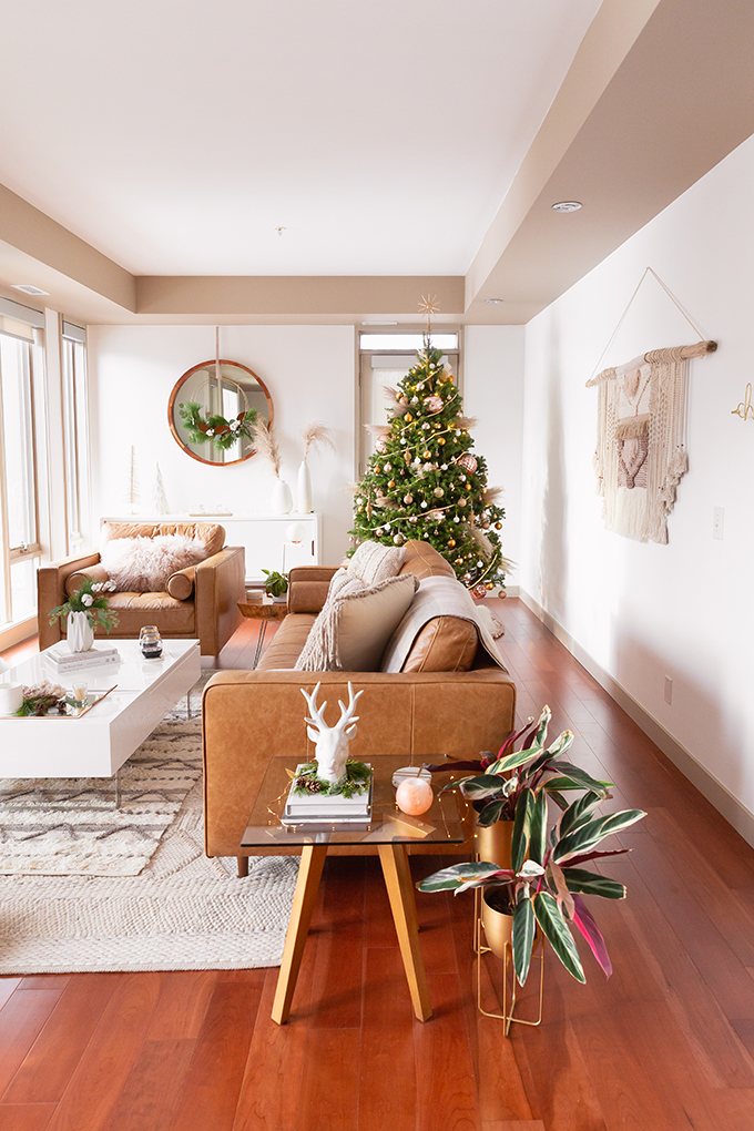 Apartment Friendly Modern Holiday Decor | Real Christmas Tree with Wood Garland, Metallic and Wood Ornaments and Pampas Grass | Premium Nova Scotia Balsam Fir Tree | Bohemian, Mid Century Modern Holiday Decor | Bohemian Holiday Home Tour 2018 | Caramel Mid Century Modern Leather Couches | Canadian Tire CANVAS Ornaments // JustineCelina.com 