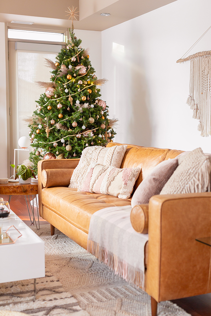 Apartment Friendly Modern Holiday Decor | Real Christmas Tree with Wood Garland, Metallic and Wood Ornaments and Pampas Grass | Premium Nova Scotia Balsam Fir Tree | Bohemian, Mid Century Modern Holiday Decor | Bohemian Holiday Home Tour 2018 | Caramel Mid Century Modern Leather Couches | Canadian Tire CANVAS Ornaments // JustineCelina.com