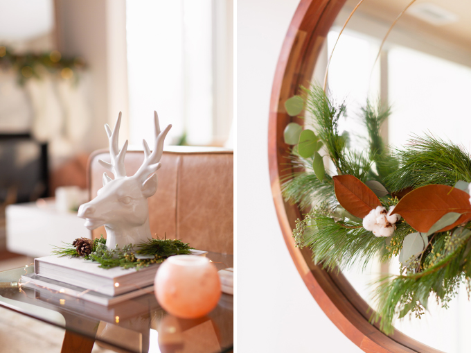 Apartment Friendly Modern Holiday Decor | White Reindeer Head Sculpture with with added greenery and fairy lights | DIY Modern Holiday Wreath with Magnolia Leaves, Cotton, Silver Dollar Eucalyptus, Seeded Eucalyptus, Cedar and Insense Cedar | Bohemian, Mid Century Modern Holiday Decor | Bohemian Holiday Home Tour 2018 | Caramel Mid Century Modern Leather Couches | Canadian Tire CANVAS Ornaments // JustineCelina.com 