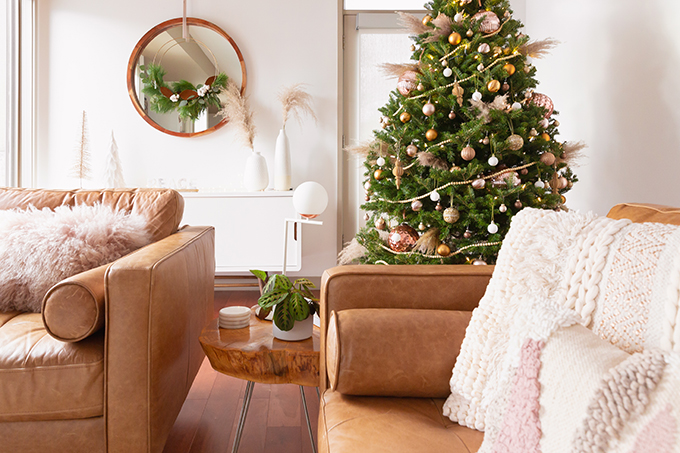 Apartment Friendly Modern Holiday Decor | Real Christmas Tree with Wood Garland, Metallic and Wood Ornaments and Pampas Grass | Premium Nova Scotia Balsam Fir Tree | Bohemian, Mid Century Modern Holiday Decor | Bohemian Holiday Home Tour 2018 | Caramel Mid Century Modern Leather Couches | Canadian Tire CANVAS Ornaments // JustineCelina.com 