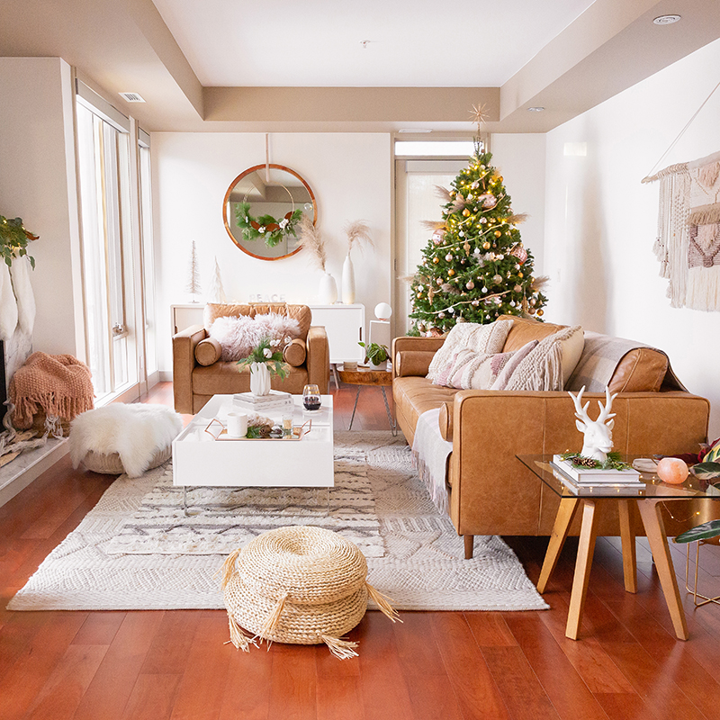 Apartment Friendly Modern Holiday Decor | Real Christmas Tree with Wood Garland, Metallic and Wood Ornaments and Pampas Grass | Premium Nova Scotia Balsam Fir Tree | Bohemian, Mid Century Modern Holiday Decor | Bohemian Holiday Home Tour 2018 | Caramel Mid Century Modern Leather Couches | Canadian Tire CANVAS Ornaments // JustineCelina.com