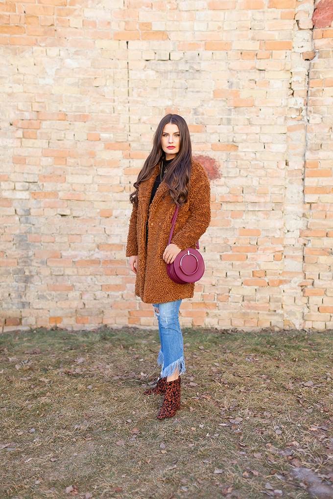 Winter 2019 Lookbook | Teddy Texture: How to Style a Teddy Coat for Mild Winter Weather | Paisie Teddy Coat styled with Kick Flare, Fringe Hem Jeans, Leopard Print TopShop Brooklyn Block Heel Booties and A Burgundy Circular Bag  | Stylish Winter 2019 Outfit Ideas | Cool Girl Winter Outfit Ideas // Calgary, Alberta, Canada Fashion & Lifestyle Blogger // JustineCelina.com
