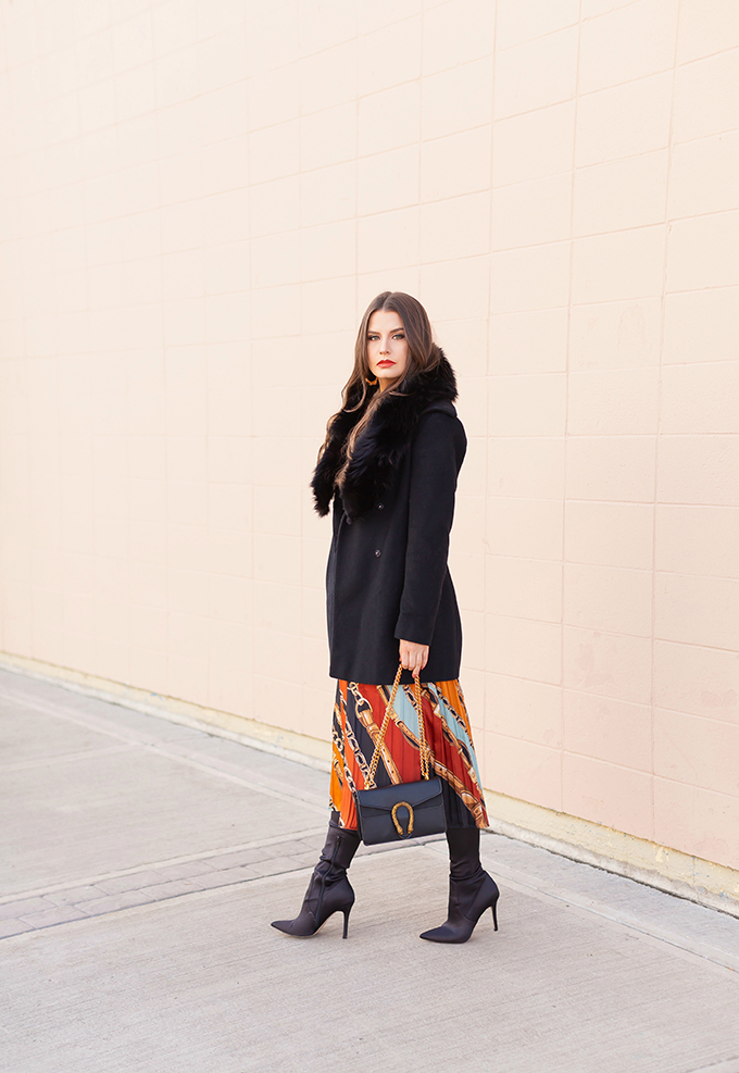 Winter 2019 Lookbook | In Chains: How to Style Midi Dresses for Winter | How to Style Chain Print | Brunette Girl wearing a chain print midi dress, a black wool coat with vintage fox fur collar, satin boots, black oval sunglasses and a black Gucci Dionysus Small Shoulder Bag | Bohemian Winter Style Ideas | Pantone Spring Summer 2019 Fashion Ideas | Winter Evening Outfit Ideas | Calgary, Alberta, Canada Fashion & Lifestyle Blogger // JustineCelina.com