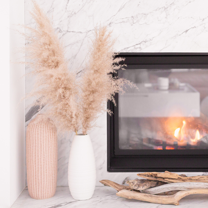 February 2019 Soundtrack | A cozy, modern marble fireplace decorated with driftwood and vases with pampas grass | Bohemian, Mid Century Modern Decor | Calgary Lifestyle Blogger // JustineCelina.com