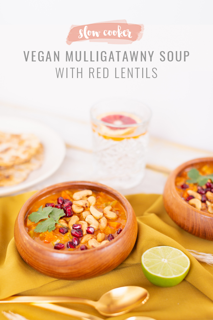 Slow Cooker Vegan Mulligatawny Soup with Red Lentils | #vegan #glutenfree | A warm bowl of vegan mulligatawny soup garnished with roasted cashews, pomegranate arils and cilantro with gold spoons and citrus water | The best vegan mulligatawny soup slow cooker recipe | vegetarian mulligatawny soup | vegetarian mulligatawny soup recipe lentils | vegetarian mulligatawny soup slow cooker | mulligatawny soup crock pot | best winter vegan slow cooker recipes // JustineCelina.com