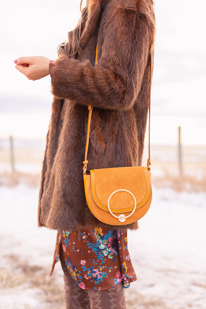 Pre Spring 2019 Trend Guide Bohemian Rhapsody: How to Style Midi Dresses for Transitional Spring Weather | Brunette Girl Standing in a Country Field at Sunrise Wearing a Brown Faux Fur Coat and Brown Wide Brim Hat | Bohemian Early Spring Style Ideas | Pantone Spring Summer 2019 Fashion Ideas | Calgary, Alberta, Canada Fashion & Lifestyle Blogger // JustineCelina.com