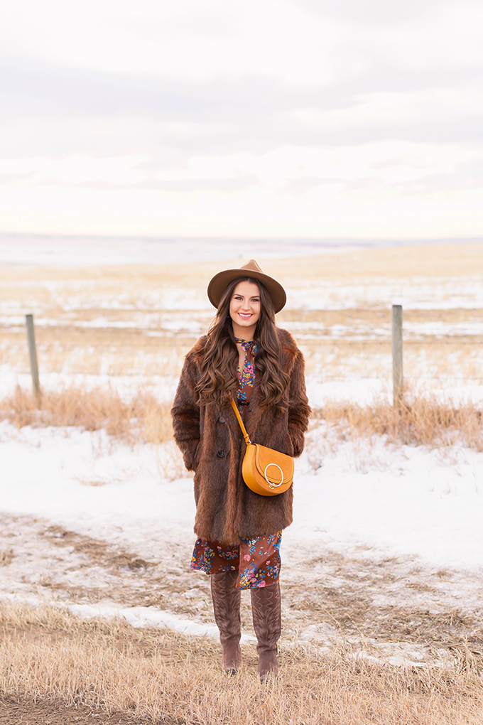 Pre Spring 2019 Trend Guide Bohemian Rhapsody: How to Style Midi Dresses for Transitional Spring Weather | Brunette Girl Standing in a Country Field at Sunrise Wearing a Brown Faux Fur Coat and Brown Wide Brim Hat | Bohemian Early Spring Style Ideas | Pantone Spring Summer 2019 Fashion Ideas | Calgary, Alberta, Canada Fashion & Lifestyle Blogger // JustineCelina.com