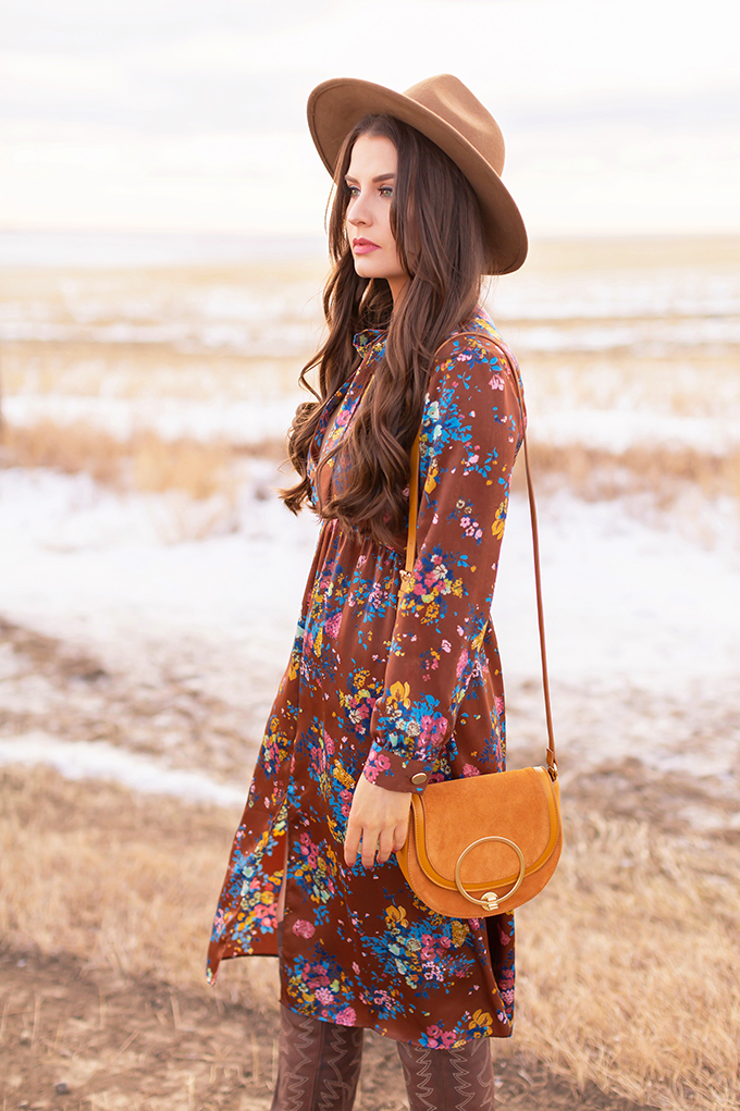 Pre Spring 2019 Trend Guide Bohemian Rhapsody: How to Style Midi Dresses for Transitional Spring Weather | Brunette Girl Standing in a Country Field at Sunrise Wearing a Brown Floral Dress, Brown Wide Brim Hat and a Mustard Cross Body Bag | Bohemian Winter Style Ideas | Pantone Spring Summer 2019 Fashion Ideas | Calgary, Alberta, Canada Fashion & Lifestyle Blogger // JustineCelina.com