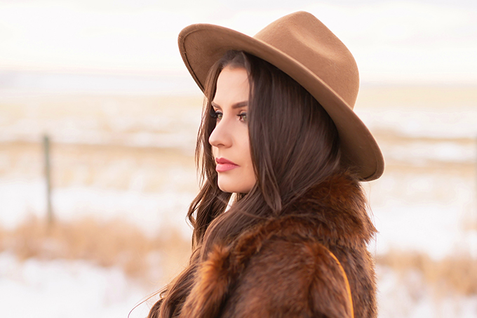 Pre Spring 2019 Trend Guide Bohemian Rhapsody: How to Style Midi Dresses for Transitional Spring Weather | Brunette Girl Standing in a Country Field at Sunrise Wearing a Brown Faux Fur Coat and Brown Wide Brim Hat | Bohemian Early Spring Style Ideas | Pantone Spring Summer 2019 Fashion Ideas | Calgary, Alberta, Canada Fashion & Lifestyle Blogger // JustineCelina.com