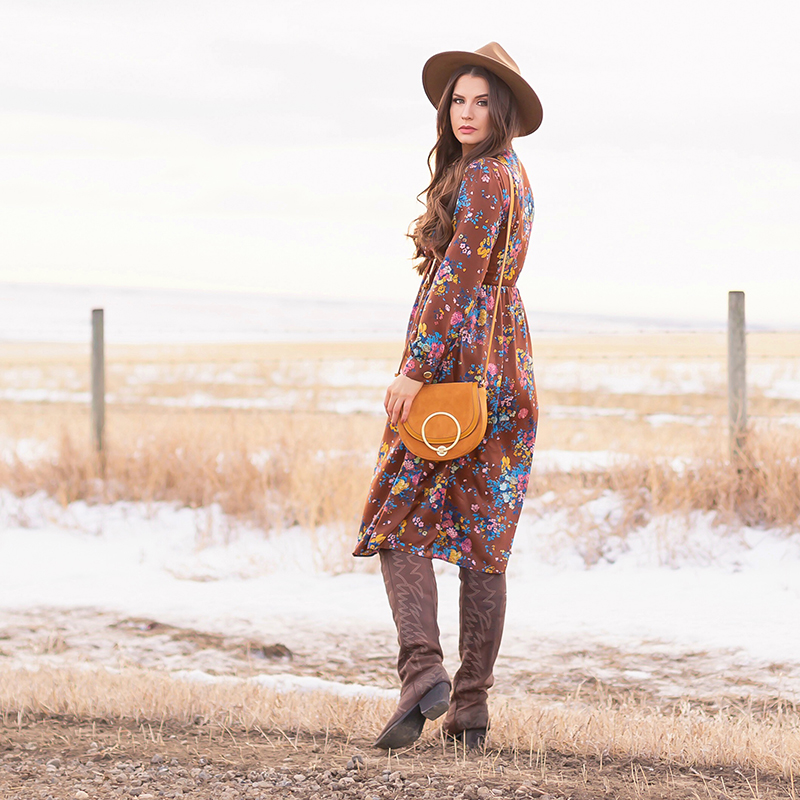 Pre Spring 2019 Trend Guide Bohemian Rhapsody: How to Style Midi Dresses for Transitional Spring Weather | Brunette Girl Standing in a Country Field at Sunrise Wearing a Brown Floral Dress, Brown Wide Brim Hat and a Mustard Cross Body Bag | Bohemian Winter Style Ideas | Pantone Spring Summer 2019 Fashion Ideas | Calgary, Alberta, Canada Fashion & Lifestyle Blogger // JustineCelina.com