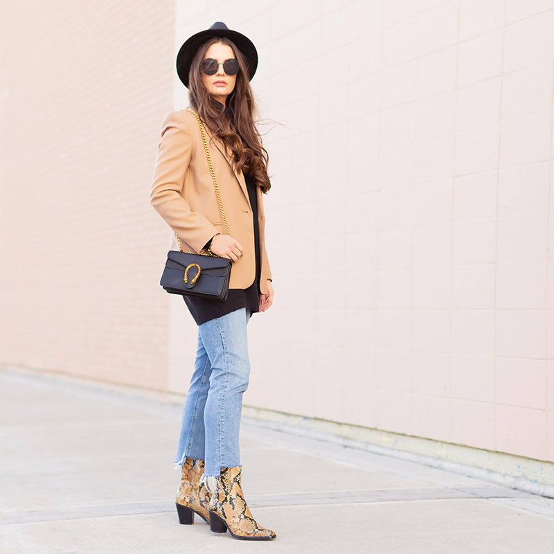 Spring 2019 Trend Guide | Modern Western: How to Style Snakeskin Ankle Boots for Transitional Winter to Spring Weather | Western Snakeskin Ankle Boots Styled With Cropped, Stem Hem Jeans, An Oversized Black Sweater, A Tan Boyfriend Blazer, a Black, Wide Brim Hat and a Gucci Dionysus Small Shoulder Bag | Bohemian Spring Transitional Style Ideas | How to Wear the Western Trend for 2019 | Calgary, Alberta, Canada Fashion & Lifestyle Blogger // JustineCelina.com