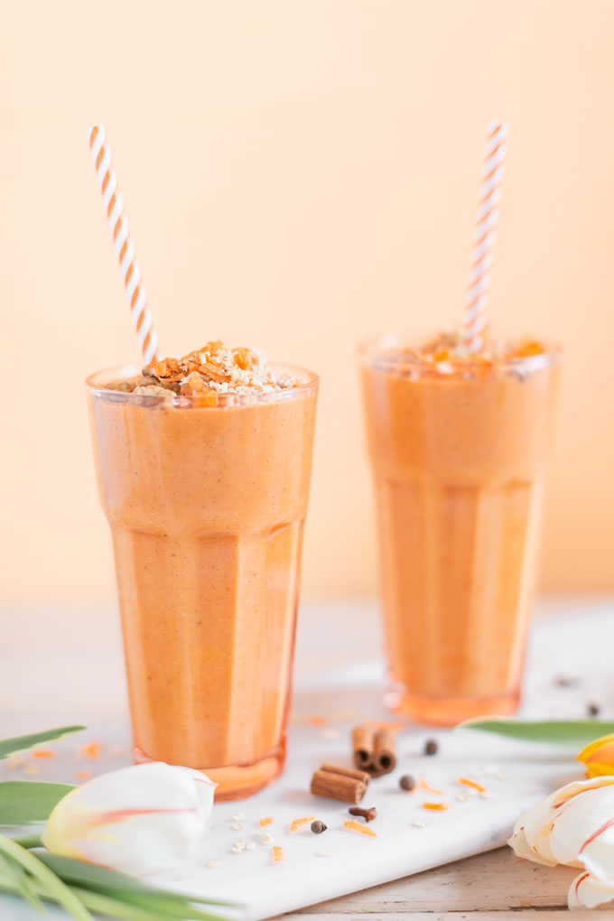 Vegan Cardamom Carrot Cake Smoothie | healthy carrot cake smoothie, cardamom carrot cake smoothie recipe, cardamom carrot cake smoothie vegan, cardamom carrot cake smoothie image, cardamom carrot cake smoothies, paleo carrot cake smoothie, vegan paleo carrot cake smoothie, the best vegan carrot cake smoothie, 2 carrot cake smoothies with spring tulips against a creamsicle orange pastel background and a marble serving board | Calgary, Alberta Creative Lifestyle Blogger // JustineCelina.com