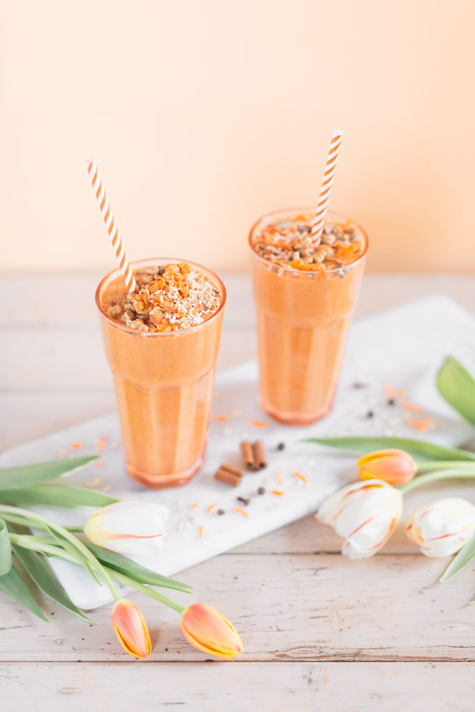 Vegan Cardamom Carrot Cake Smoothie | healthy carrot cake smoothie, cardamom carrot cake smoothie recipe, cardamom carrot cake smoothie vegan, cardamom carrot cake smoothie image, cardamom carrot cake smoothies, paleo carrot cake smoothie, vegan paleo carrot cake smoothie, the best vegan carrot cake smoothie, 2 carrot cake smoothies with spring tulips against a creamsicle orange pastel background and a marble serving board  | Calgary, Alberta Creative Lifestyle Blogger // JustineCelina.com