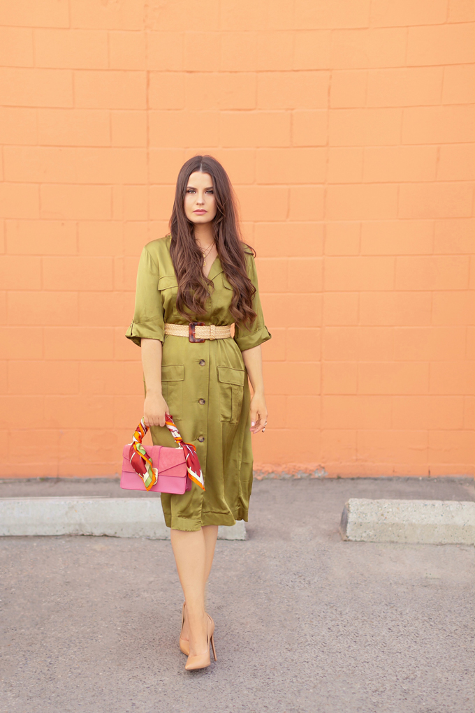 SPRING/SUMMER 2019 LOOKBOOK | Utilitarian Luxury: How to Style a the Utility Trend for Spring | Utility Cargo Outfit Ideas Spring 2019 | Professional Spring/Summer 2019 Outfits | Brunette woman wearing an Olive Green Satin Cargo Dress, raffia belt, nude pumps and pink handbag with a vintage scarf | How to Wear the Pantone SS19 Fashion Colour Trend Report | Top Spring/Summer 2019 Trends and how to wear them | Calgary Fashion Blogger // JustineCelina.com