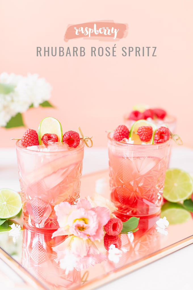 Raspberry Rhubarb Rosé Spritz | A refreshing, clean, refined sugar free cocktail | A summer-inspired trio of rhubarb, raspberries and honey combine in a scratch-made Honeyed Raspberry Rhubarb Syrup to infuse this effervescent cocktail with seasonal panache, beautifully complimented by sparkling rosé, soda water, fresh lime juice and a dash of bitters | Rosé spritzer recipe | Rosé cocktail | Rosé wine spritzer | summer cocktails with vodka // JustineCelina.com