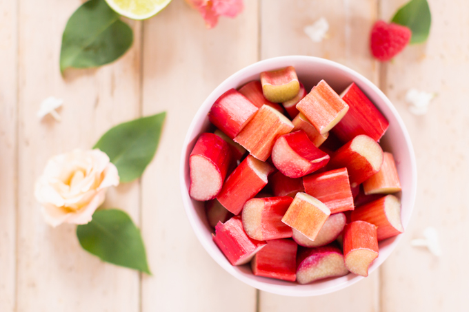  Raspberry Rhubarb Rosé Spritz | A refreshing, clean, refined sugar free cocktail | Fresh Chopped Rhubarb in a Bowl | Rosé spritzer recipe | Rosé cocktail | Rosé wine spritzer | summer cocktails with vodka // JustineCelina.com