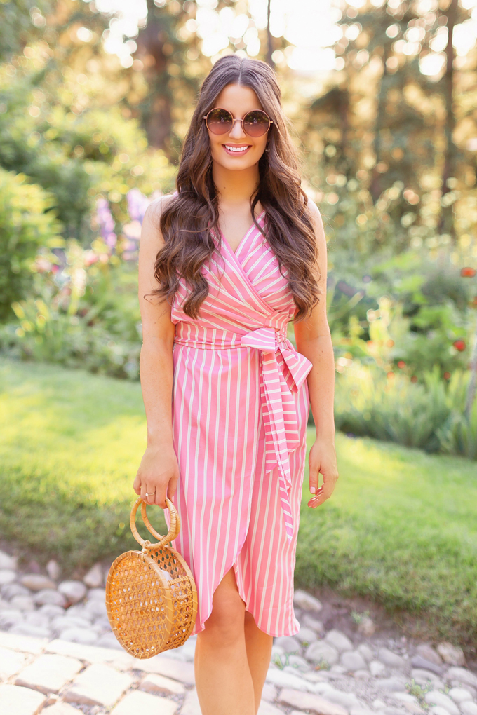 What to Wear to | A Casual Summer Wedding | Outdoor Summer Wedding Outfit Ideas | Brunette Woman wearing a Pantone Living Coral Wrap Dress with a Circular Bamboo Bracelet Bag | 3rd Floor Studio Isla Wrap Dress | How to Dress for a Casual Outdoor Summer Wedding | Summer Dresses to Wear to a Wedding | How to Wear Pantone Colour of the Year 2019 Living Coral | Reader Rock Park Calgary Wedding | Calgary Fashion and Lifestyle Blogger // JustineCelina.com