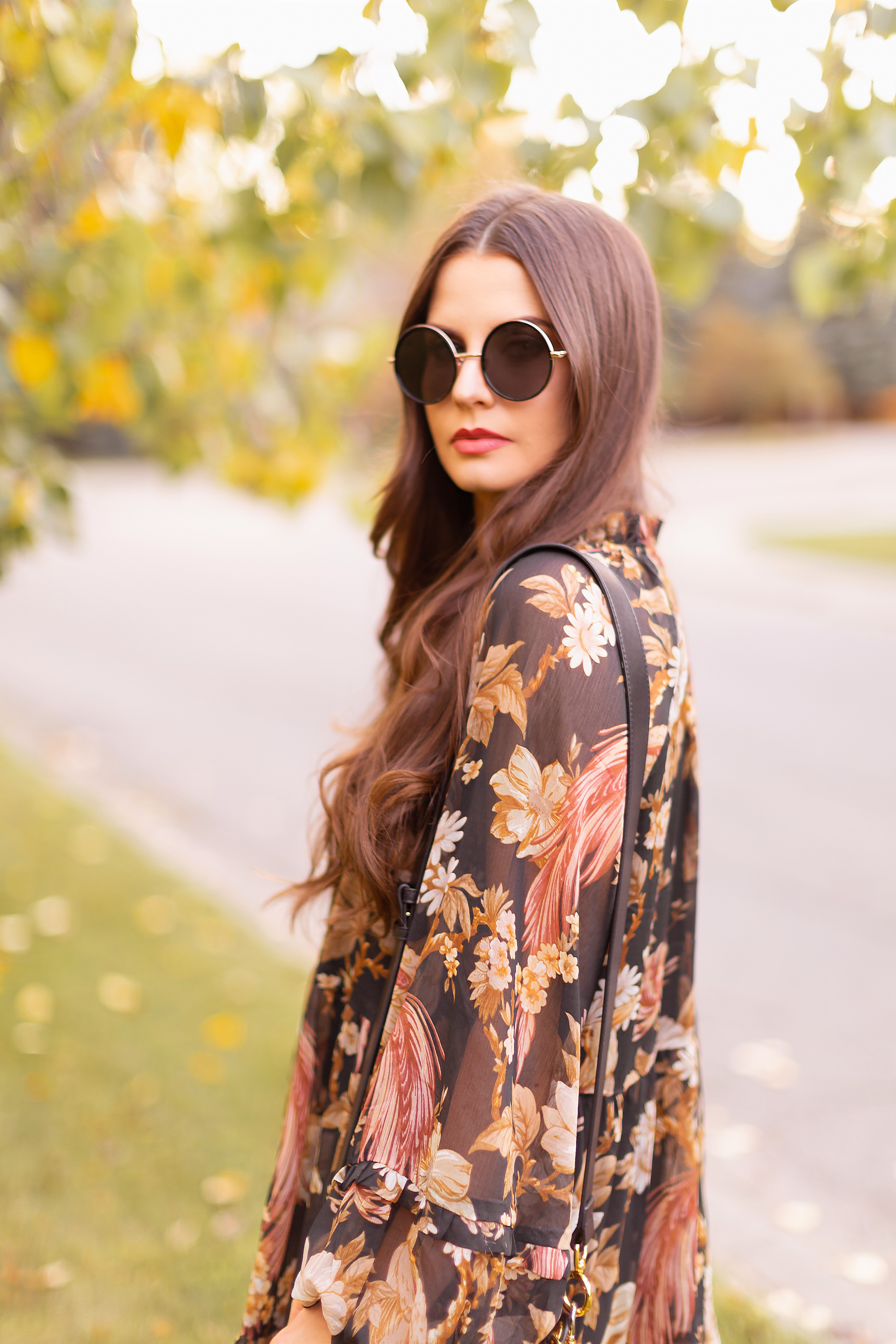 Summer to Fall 2019 Transitional Lookbook : Moody Florals | Top Summer to Fall 2019 Transitional Trends | Top Autumn 2019 Trends and How to Wear Them | The Best Moody Floral Dresses for Fall | | Brunette woman wearing an H&M Wide Cut Chiffon Floral Dress, Zara Taupe Mid-Calf Suede Boots, A Black Chloe Tess Dupe by Artisan Anything, Round Black Sunglasses and a Dark Red Lip | Top Calgary Fashion & Creative Lifestyle Blogger // JustineCelina.com