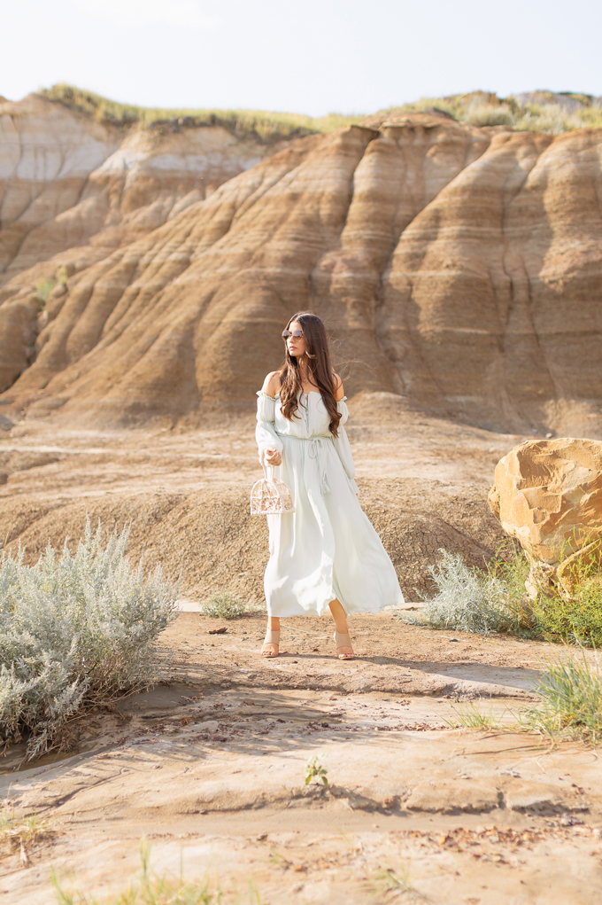 LATE SUMMER 2019 LOOKBOOK | Mint Condition: How to Style Maxi Dresses for Transitional Weather l Summer/Fall 2019 Bohemian Outfit Ideas | How to Wear a Long Sleeved Maxi Dress into Fall | How to Wear Mint | Brunette woman wearing a flowy, mint, long-sleeved maxi dress, brown wedge heeled espadrilles and a cream knotted bag | Top Summer to Fall 2019 Transitional Trends and how to wear them | HooDoos, Drumheller Bandlands, Alberta | Calgary Fashion Blogger // JustineCelina.com