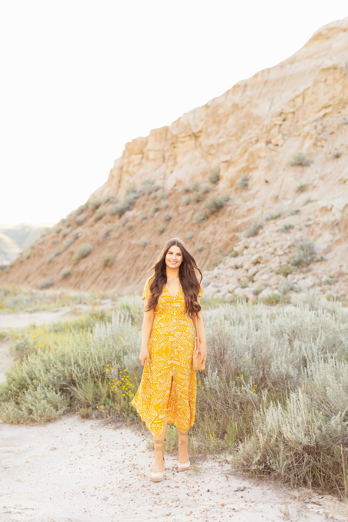 LATE SUMMER 2019 LOOKBOOK | Mustard Moment: How to Transition Midi Dresses into Autumn | How to Wear Summer Clothes in Fall | Brunette Woman wearing a button-down mustard Aztec print midi dress with a woven rattan bag and nude espadrilles | Top Summer to Fall 2019 Transitional Trends and how to wear them | HooDoos, Drumheller Bandlands, Alberta | Calgary Fashion Blogger // JustineCelina.com