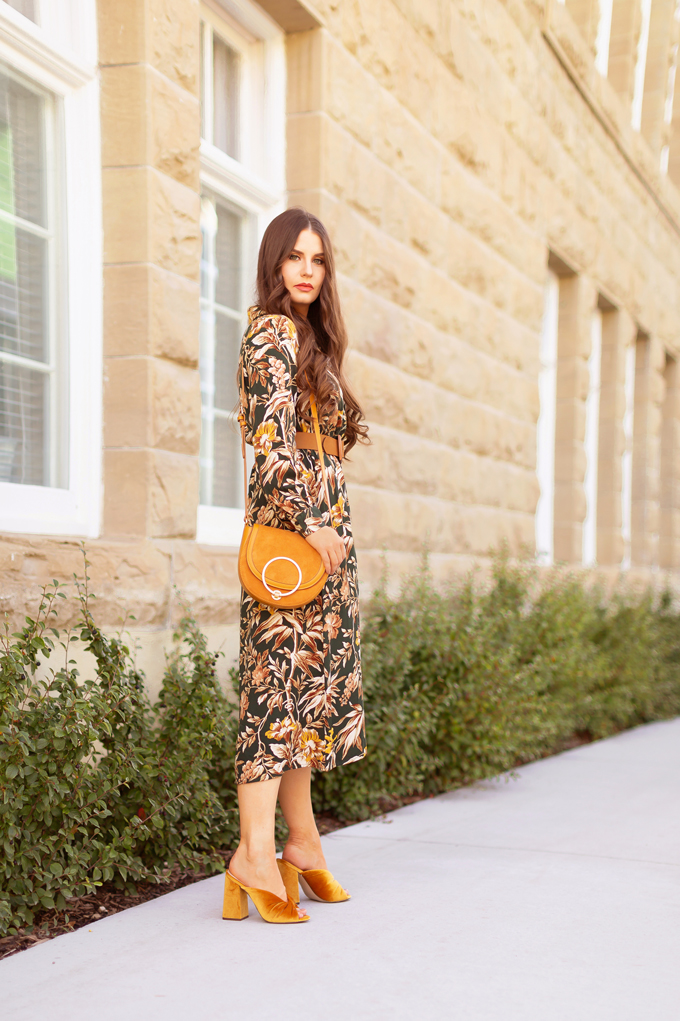 Summer to Fall 2019 Transitional Lookbook |  Top Summer to Fall 2019 Transitional Trends | Top Autumn 2019 Trends and How to Wear Them | The Best Dresses for Work | Fall 2019 Professional Outfit Ideas | Brunette woman wearing an H&M Dark Green Floral Button-Down Midi Dress, Mustard Velvet Block Heeled Sandals, Mustard Leather Bag and a Mango Leather Belt with Wooden Buckle | Top Calgary Fashion & Creative Lifestyle Blogger // JustineCelina.com