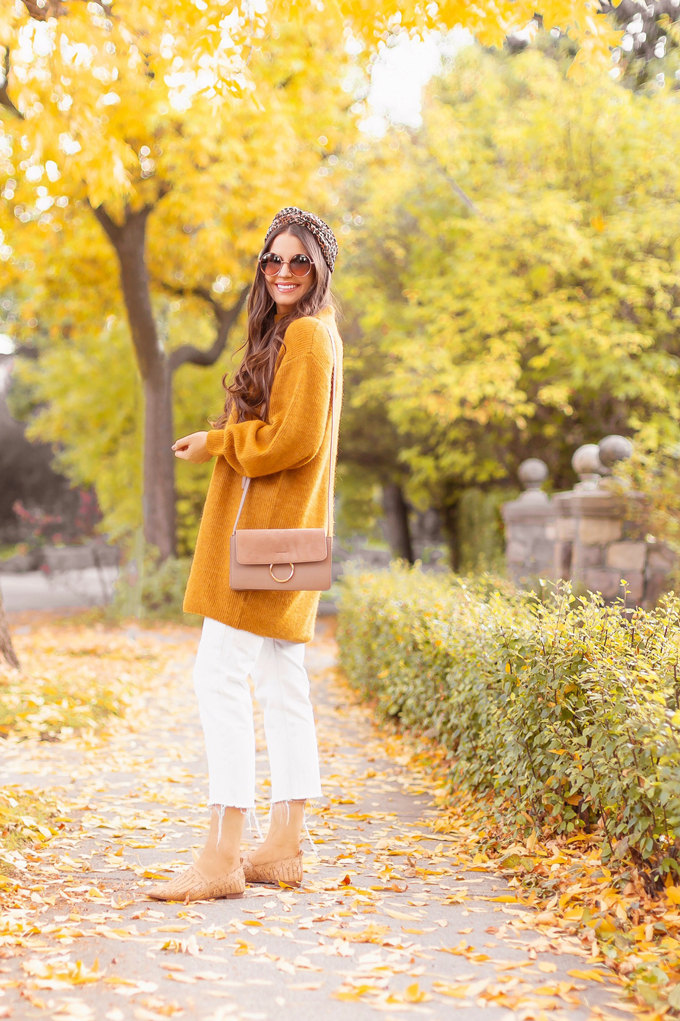 Summer to Fall 2019 Transitional Lookbook | Top Summer to Fall 2019 Transitional Trends | Top Autumn 2019 Trends and How to Wear Them | Fall 2019 Casual Outfit Ideas | Brunette woman wearing an oversized mustard sweater, crop white jeans, Joe Fresh light brown Mixed Media Crossbody Bag, Mango babouches, Round sunglasses and a leopard print turban style headband | Top Calgary Fashion & Creative Lifestyle Blogger // JustineCelina.com